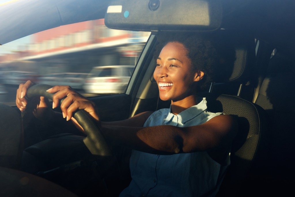 woman happy while driving